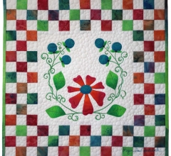 whimsical wildflower quilt with stylized blueberries